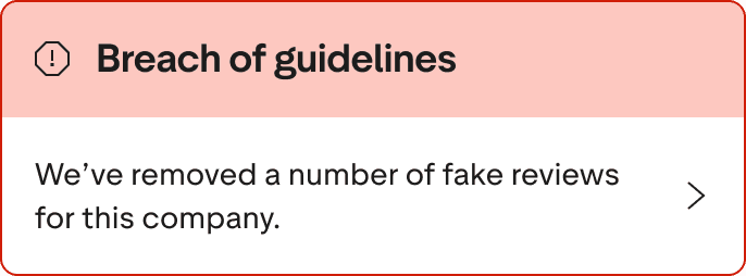 A Red warning alert banner that says "Breach of guidelines. We've removed a number of fake reviews for this company."