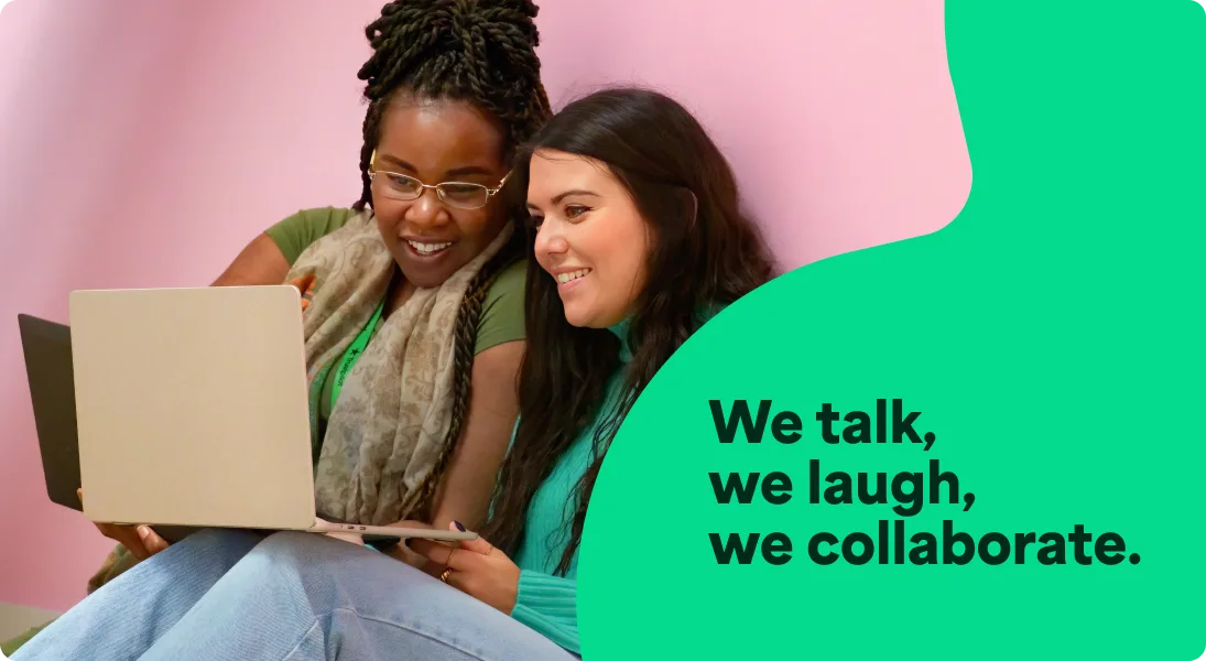 A photo of two women working together on a laptop with an overlay of text that says We talk, we laugh, we collaborate.